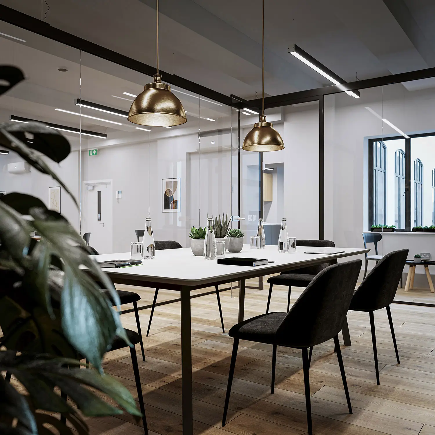 Modern meeting room with glass walls, pendant lights, and minimalist decor in an office setting